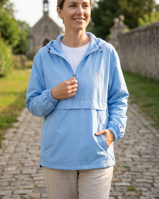 Woman wearing the Marian Cross Embroidered Jacket in Light Blue (studio photo)